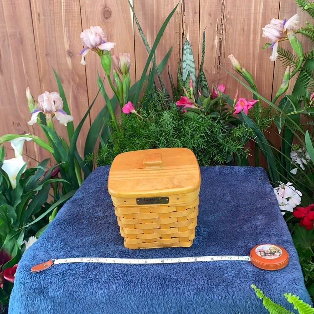 Square Longaberger basket with angled top and wooden lid with knob handle